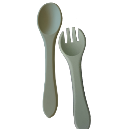 Spoon and fork set in green on a white background